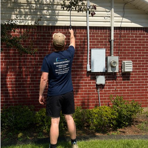 Reaching high siding and soffit with an extension wand