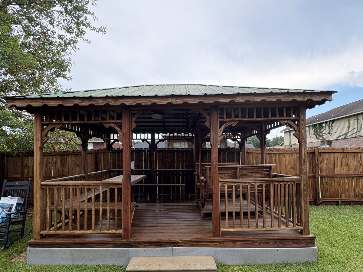 Gazebo after cleaning — rich brown wood restored